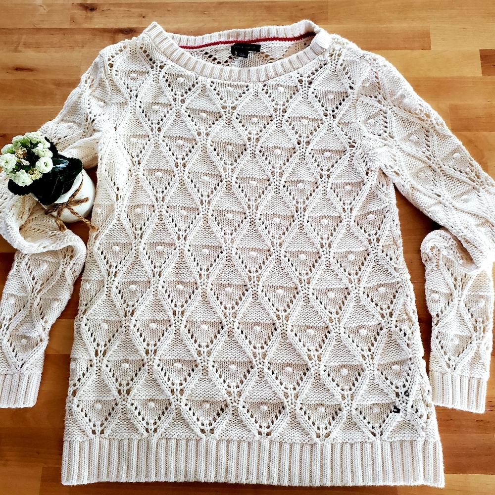 White pearl sweater.